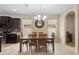 Dining room with seating for six, chandelier, and abundant natural light at 2136 J Lawson Blvd, Orlando, FL 32824