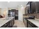 Spacious kitchen features stainless steel appliances, granite counters, and tile backsplash at 2136 J Lawson Blvd, Orlando, FL 32824