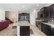 Spacious kitchen features stainless steel appliances, granite counters, and open concept floorplan at 2136 J Lawson Blvd, Orlando, FL 32824