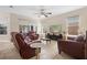 Comfortable living room with large windows and views of the lanai at 2136 J Lawson Blvd, Orlando, FL 32824