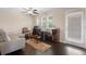 Comfortable living room with hardwood floors, a white couch, and lots of natural light from the windows at 2136 J Lawson Blvd, Orlando, FL 32824