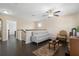 Upstairs loft with hardwood floors, a comfortable couch, and a stylish accent chair at 2136 J Lawson Blvd, Orlando, FL 32824