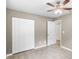 Neutral bedroom features wood-look tile flooring and a closet at 2312 Ne 32Nd Pl, Ocala, FL 34479