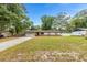 Charming single-story home with a well-manicured front yard and attached garage, perfect for suburban living at 2312 Ne 32Nd Pl, Ocala, FL 34479