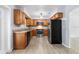 Well-lit kitchen with wooden cabinets, stainless steel appliances, and a neutral wall paint at 2312 Ne 32Nd Pl, Ocala, FL 34479