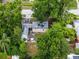 Aerial view of home with an outdoor patio surrounded by mature trees at 2312 Vivada St, Orlando, FL 32803