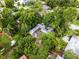Beautiful home with mature trees providing shade and privacy in an aerial view at 2312 Vivada St, Orlando, FL 32803