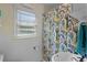 Bright bathroom featuring a tub, window and sink at 2312 Vivada St, Orlando, FL 32803