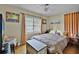 Bright bedroom features a ceiling fan, hardwood floors and natural light at 2312 Vivada St, Orlando, FL 32803