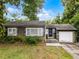 Charming single-story home with gray siding, inviting front porch, and a one-car garage at 2312 Vivada St, Orlando, FL 32803