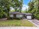 Charming single-story home with gray siding, inviting front porch, and a one-car garage at 2312 Vivada St, Orlando, FL 32803
