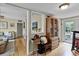Hallway area showcasing the hardwood floors and access to other rooms at 2312 Vivada St, Orlando, FL 32803