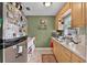 Cozy kitchen features wood cabinets and plenty of counter space at 2312 Vivada St, Orlando, FL 32803