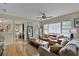 Inviting living room featuring hardwood floors, a cozy seating area, and natural light at 2312 Vivada St, Orlando, FL 32803
