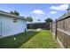 Fenced backyard with an area to relax under shade, featuring an outdoor space at 233 E Church Ave, Longwood, FL 32750