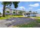 Charming home, screened porch, simple landscaping, and close proximity to businesses and apartment buildings at 233 E Church Ave, Longwood, FL 32750