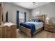 Comfortable bedroom featuring a large bed, soft lighting, and a calming color palette at 2518 Hayden Valley St, Apopka, FL 32703