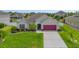 Charming single-Gathering home boasts a manicured lawn and beautiful landscaping at 2518 Hayden Valley St, Apopka, FL 32703