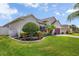 Beautiful single-Gathering home with a well-manicured lawn and mature landscaping at 2518 Hayden Valley St, Apopka, FL 32703