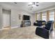 Living room featuring a fireplace, tile floors, and comfortable black leather sofas at 2518 Hayden Valley St, Apopka, FL 32703