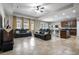 Open-concept living space with a kitchen, dining area, and comfortable seating at 2518 Hayden Valley St, Apopka, FL 32703