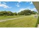 Spacious backyard with a well-maintained lawn and serene views of lush greenery at 2640 Shelby Ruth Pl, St Cloud, FL 34769