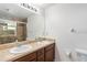 Double vanity bathroom with tile shower, offering functionality and style at 2640 Shelby Ruth Pl, St Cloud, FL 34769