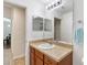 Bright bathroom with modern fixtures, a large mirror, and a conveniently located towel rack at 2640 Shelby Ruth Pl, St Cloud, FL 34769