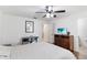 Comfortable bedroom with desk space, a fan, and a view, providing a relaxing retreat at 2640 Shelby Ruth Pl, St Cloud, FL 34769