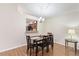 Inviting dining area with hardwood floors and modern chandelier, adjacent to the kitchen at 2640 Shelby Ruth Pl, St Cloud, FL 34769