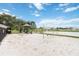 Community playground with swings, slide and play structure next to a pond at 2640 Shelby Ruth Pl, St Cloud, FL 34769