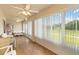 Inviting sunroom with ample windows, tile flooring, and comfortable seating for relaxation at 2640 Shelby Ruth Pl, St Cloud, FL 34769