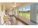 Relaxing sunroom featuring tile flooring, cozy seating and multiple windows overlooking the outdoors at 2640 Shelby Ruth Pl, St Cloud, FL 34769