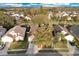 Aerial view of a single-Gathering home featuring mature landscaping and a paved driveway in a residential neighborhood at 2643 Alamosa Pl, Lake Mary, FL 32746