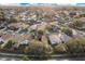 Expansive aerial view of a neighborhood with mature trees and well-maintained single-Gathering homes on a sunny day at 2643 Alamosa Pl, Lake Mary, FL 32746