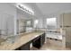 Bathroom featuring granite countertops, glass sinks, soaking tub, and glass enclosed shower at 2643 Alamosa Pl, Lake Mary, FL 32746