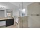 Bathroom featuring a glass shower enclosure, double sinks and granite countertops at 2643 Alamosa Pl, Lake Mary, FL 32746
