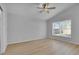 A bedroom featuring a ceiling fan, luxury vinyl floors and a window at 2643 Alamosa Pl, Lake Mary, FL 32746