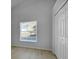 A brightly lit bedroom featuring a large window and double door closet at 2643 Alamosa Pl, Lake Mary, FL 32746