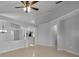 Open-concept living space with neutral paint, ceramic tile and view to kitchen at 2643 Alamosa Pl, Lake Mary, FL 32746