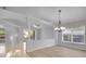 Open-concept living area with hardwood floors and modern lighting at 2643 Alamosa Pl, Lake Mary, FL 32746