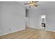 A spacious main bedroom featuring a ceiling fan and connecting bathroom at 2643 Alamosa Pl, Lake Mary, FL 32746
