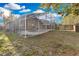 Screened pool surrounded by lawn and the home's exterior at 2643 Alamosa Pl, Lake Mary, FL 32746