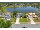 Aerial view of a home situated on a street with a lake in the background at 2681 Debany Rd, Kissimmee, FL 34744