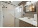 Bathroom featuring a glass shower door and a neutral color palette at 2681 Debany Rd, Kissimmee, FL 34744
