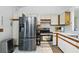 Modern kitchen equipped with stainless steel appliances, white cabinets, and ample counter space at 2681 Debany Rd, Kissimmee, FL 34744