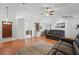 Open-concept living room featuring wood flooring, vaulted ceilings, and modern furnishings at 2681 Debany Rd, Kissimmee, FL 34744