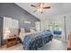 Relaxing main bedroom with vaulted ceiling, en-suite bathroom, and private access to the lanai at 2681 Debany Rd, Kissimmee, FL 34744