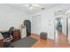 Office with hardwood floors, built in wardrobe and a view into the hall at 2681 Debany Rd, Kissimmee, FL 34744