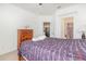 Comfortable bedroom with a ceiling fan, large window, ensuite bathroom, and a walk-in closet at 2717 Maitland Crossing # 207, Orlando, FL 32810